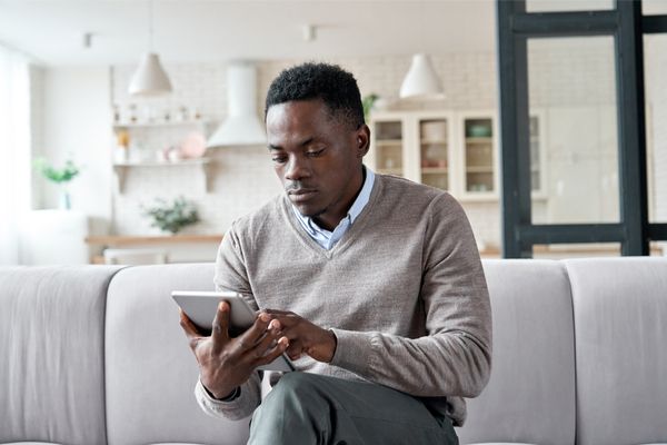 a person logging in to a virtual care session on a tablet