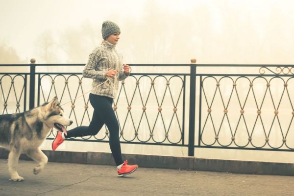 woman running with dog