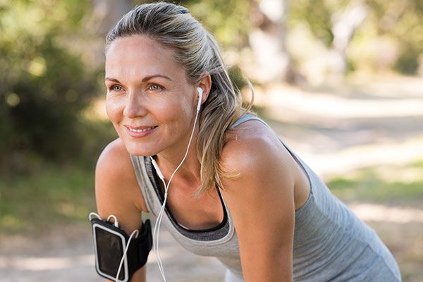 woman running with smile on face